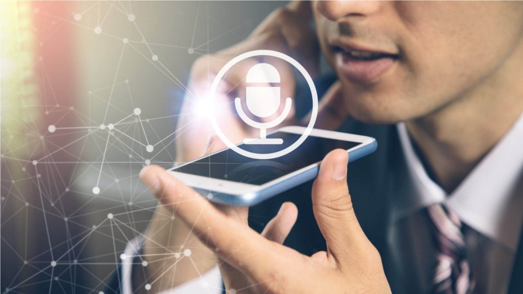 "A person speaking to a voice assistant device"